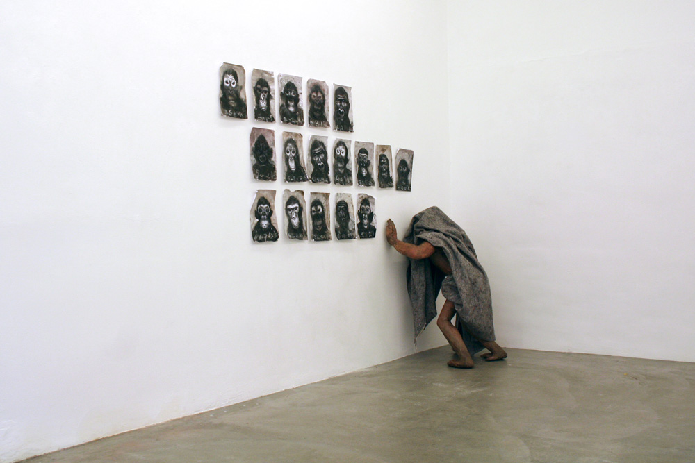 100.-War-zone-II,-Installation,-sculpture-with-17-monkey-portraits,-mixed-media,-sculpture-ceramic-plaster-mixed-media,-220-cm-x-250-x-60-cm,-2013.